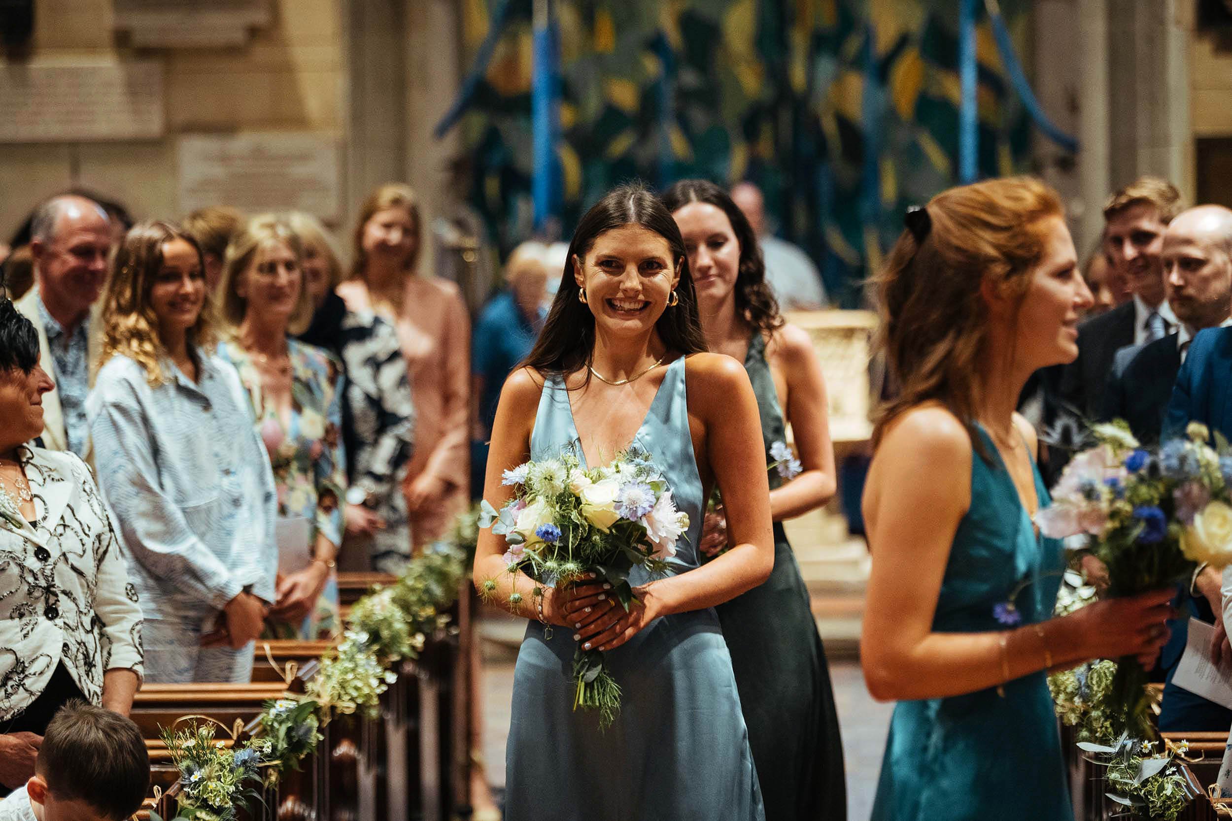 17_bridesmaids_enter_church_wedding_photographer_london