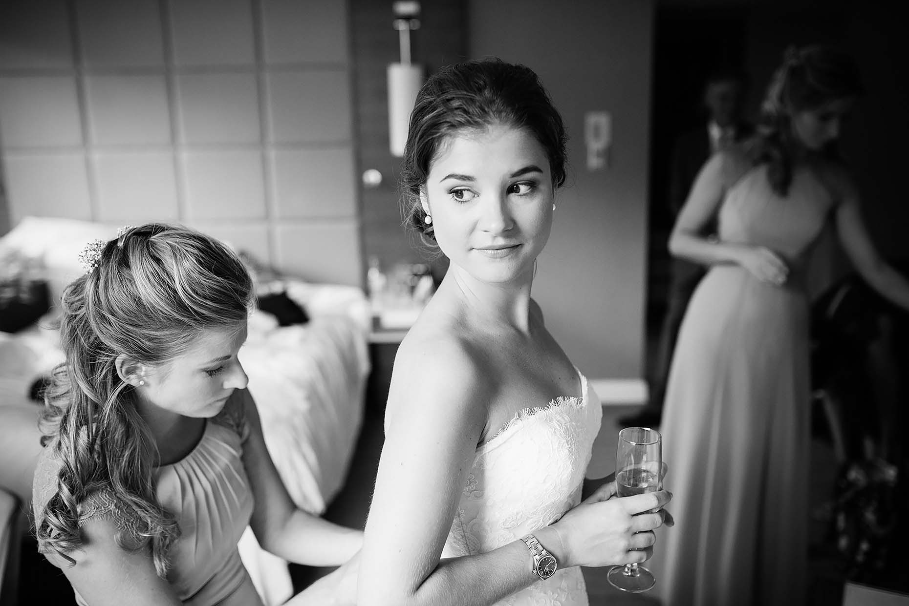 bride-glass-champagne-cambridge-wedding-photographer-dress-monochrome-02