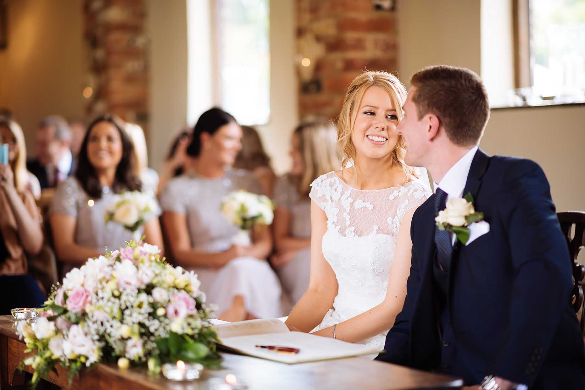 bride-groom-signed-register-dodmoor-house-northampton-wedding-photographer-31