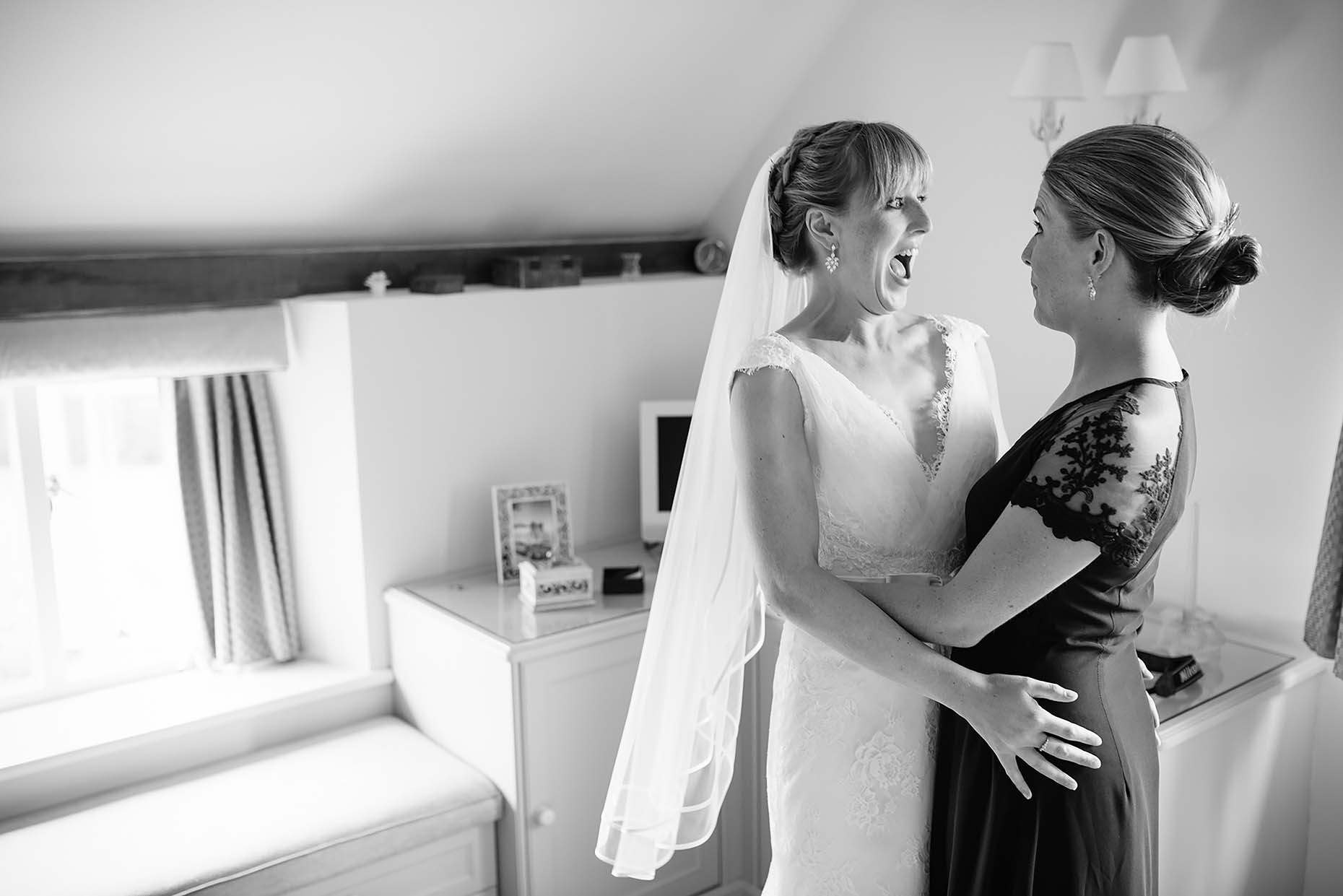 documentary-photo-bride-bridesmaid-hug-wedding-day-dorset-22