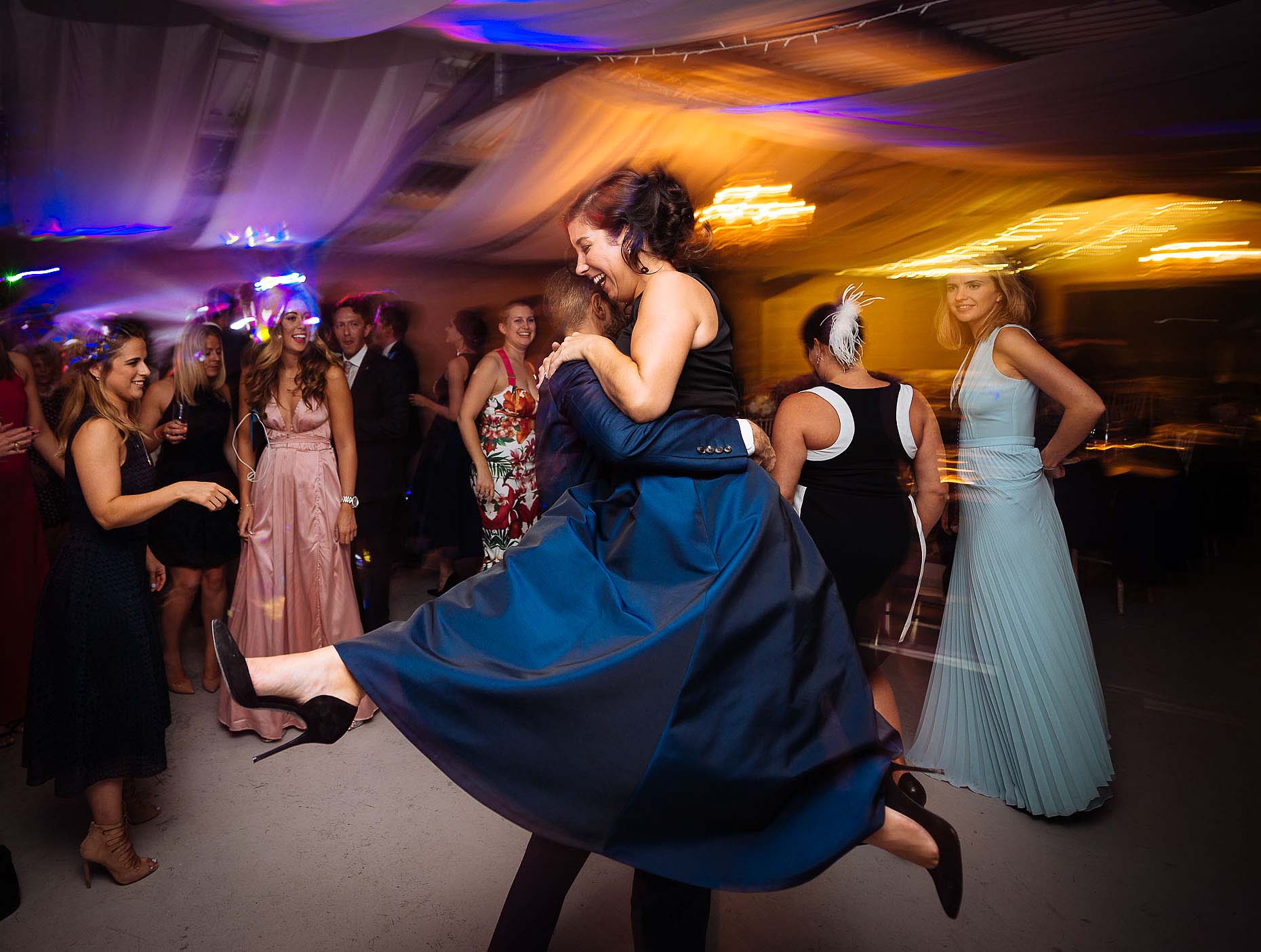 guests-dancefloor-night-motion-slow-sync-flash-technique-wedding-photography-26