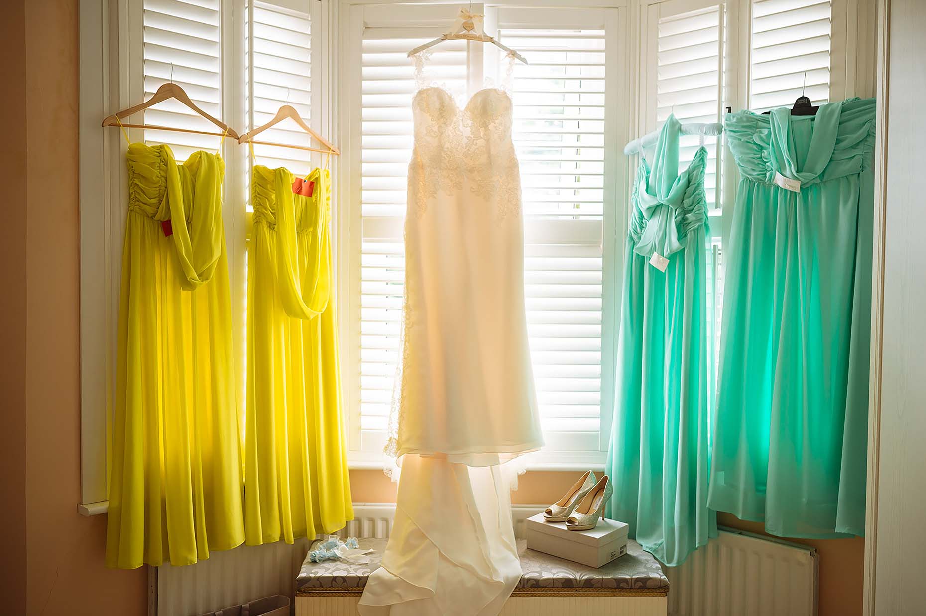 wedding-dress-bridesmaids-dresses-hanging-window-04